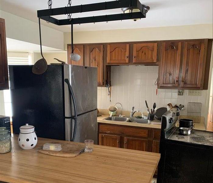 A kitchen with cabinets still intact after a fire occurred 