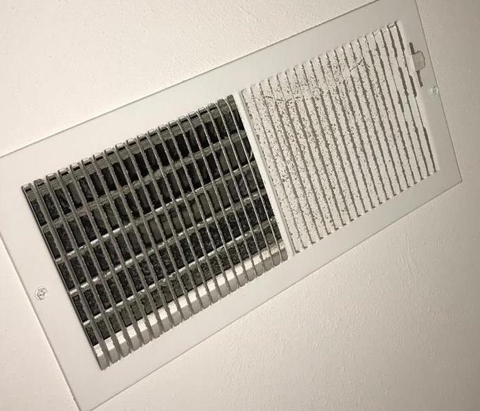 Dirty air vents in ceiling.
