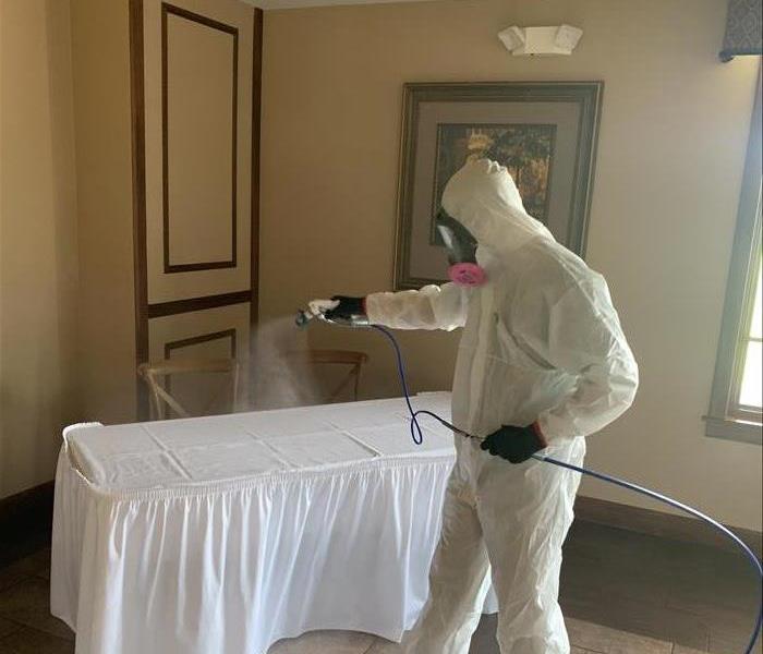 Servpro employee fogging a business with disinfectant